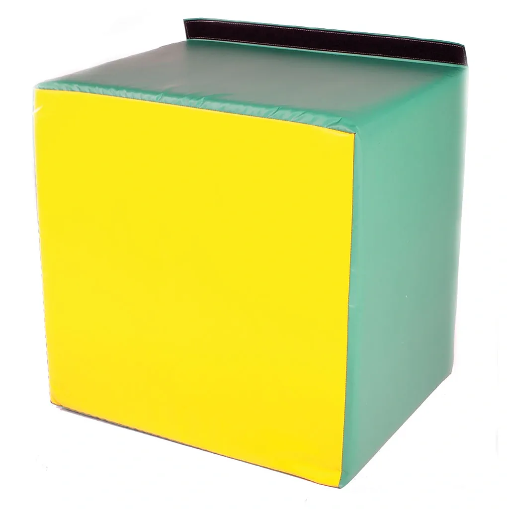 Soft foam cube with a bright yellow front, green sides and top, and a small black carrying strap along the back edge.