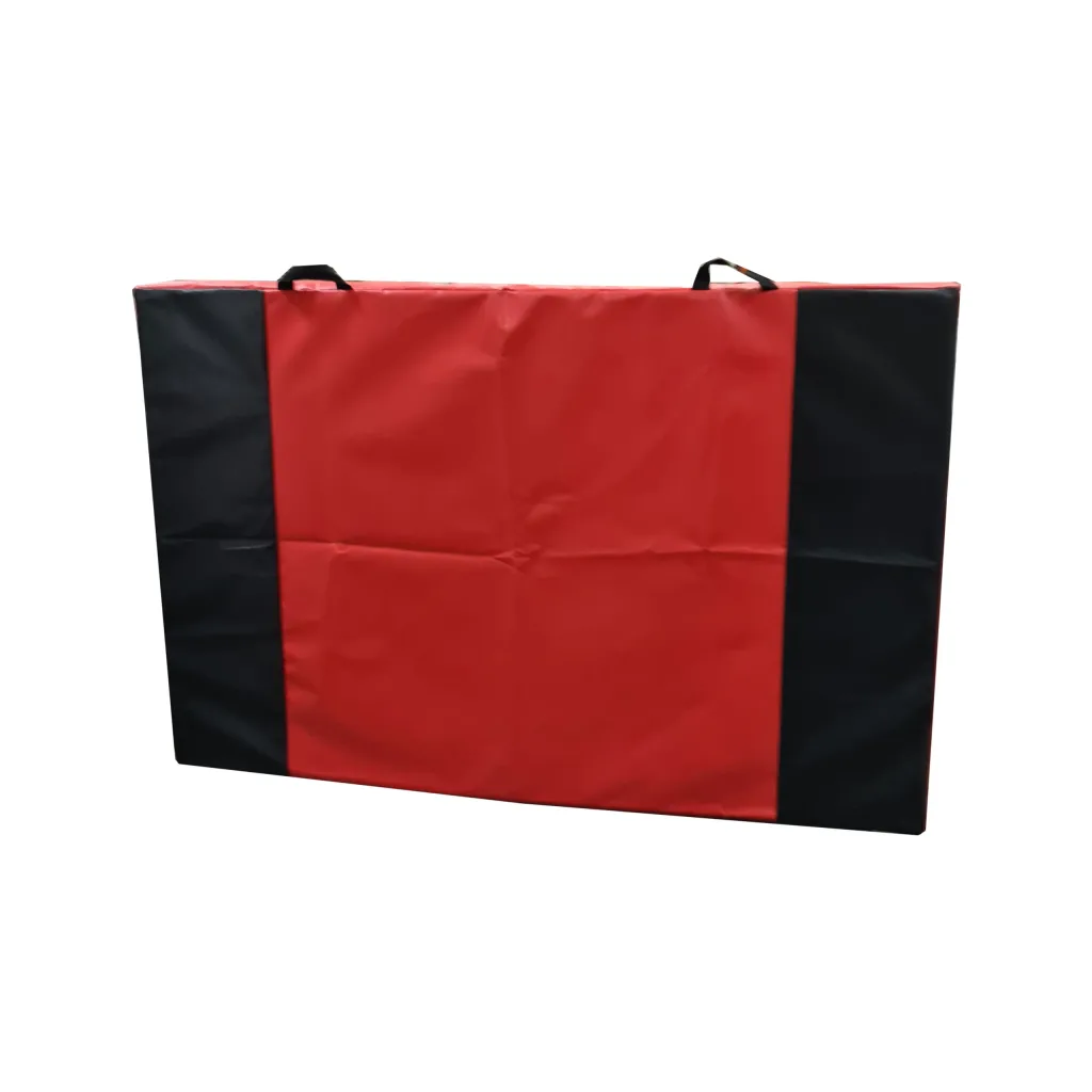 Jersey crash mat with red jersey fabric top, black side panels, top carrying handles, and a zipped flame-retardant nylon-reinforced PVC cover.