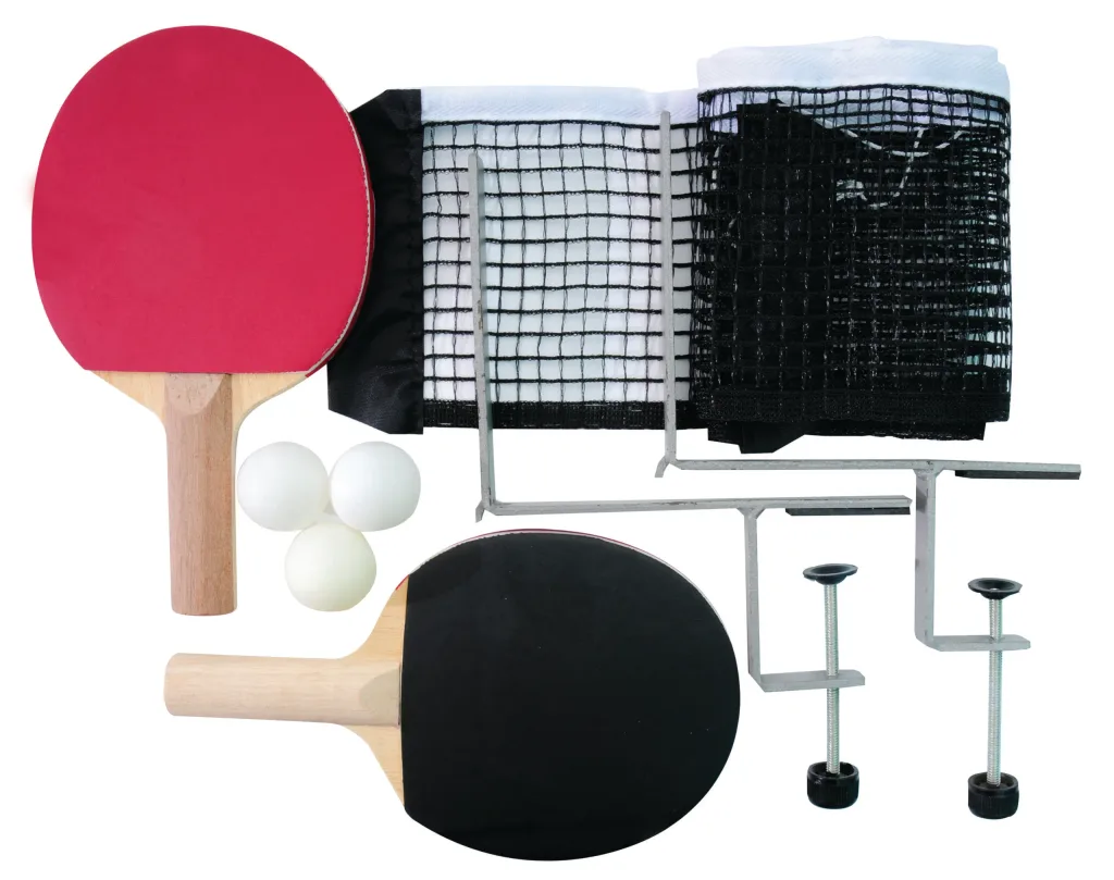 Two table tennis bats with red and black faces, three balls, a rolled black net with white edging and two metal clamps for a 9 x 5 green top.