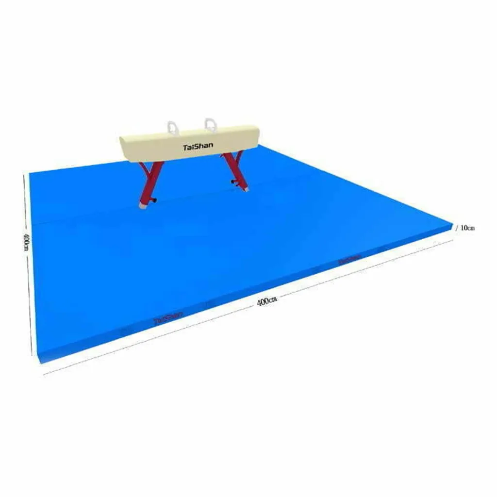 Blue landing mat with a beige balance beam labeled Taishan and red support legs on top.