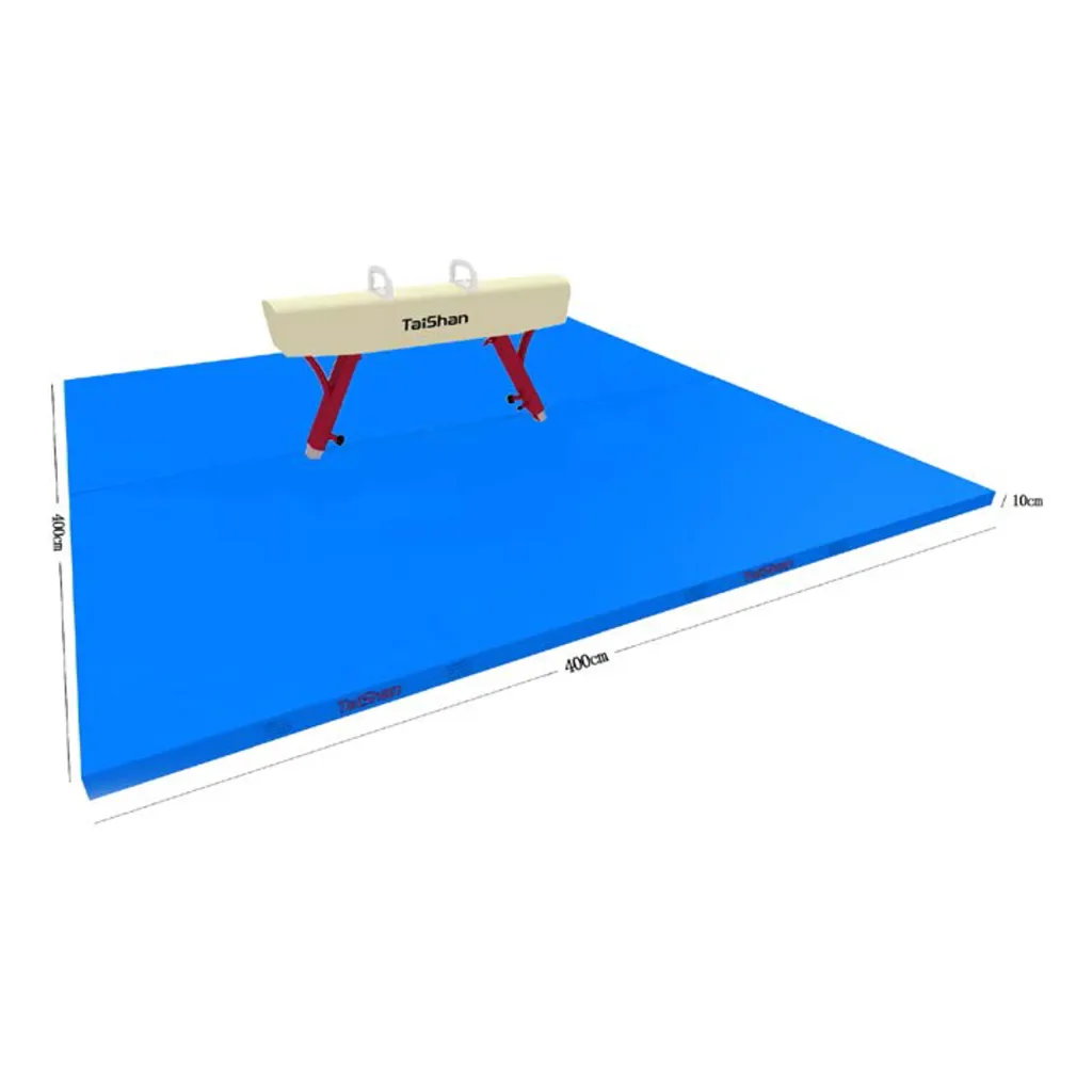 Blue competition landing mat with a beige pommel horse on top and a visible seam where two mat units join.
