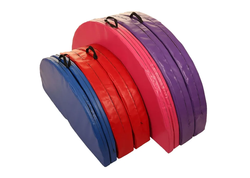 Stacked semicircular heavy-duty PVC pole mats with fixed carry handles, two-piece construction, and a central hole, shown in multiple colors.