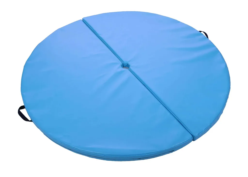 Round two-piece heavy-duty PVC pole mat with a central hole, connected by hook and loop fasteners, fixed carry handles, and designed to fit portable stage poles.
