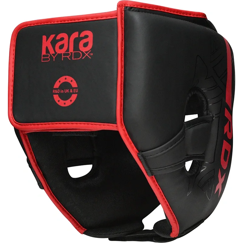 Black head guard with red trim and open face cutouts, showing text "kara BY RDX" and "R&D in UK & EU" on the front.
