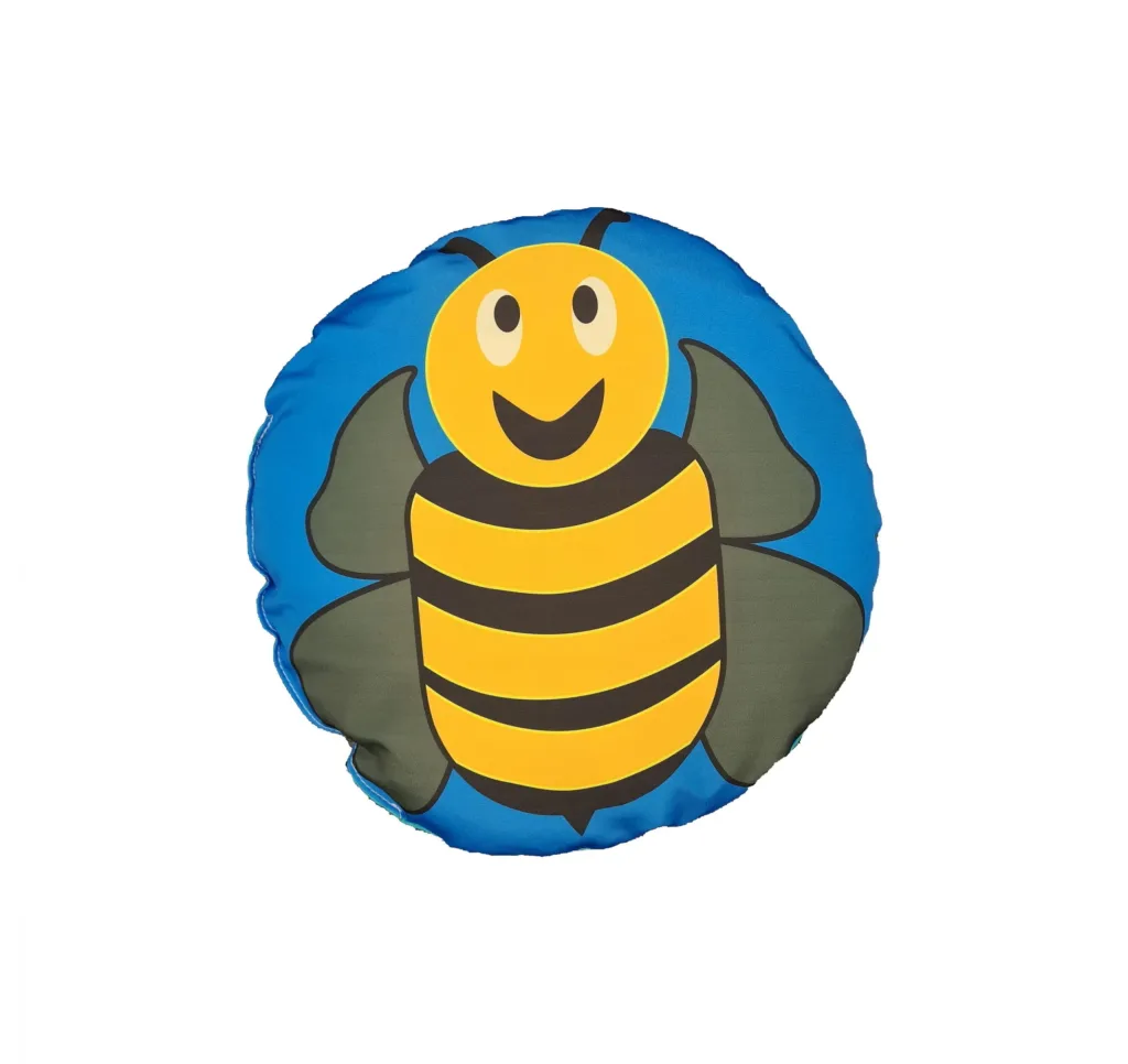 A smiling yellow and black bee is printed on a round blue child scatter cushion with green wings, fibre-filled and wipe-clean cover.