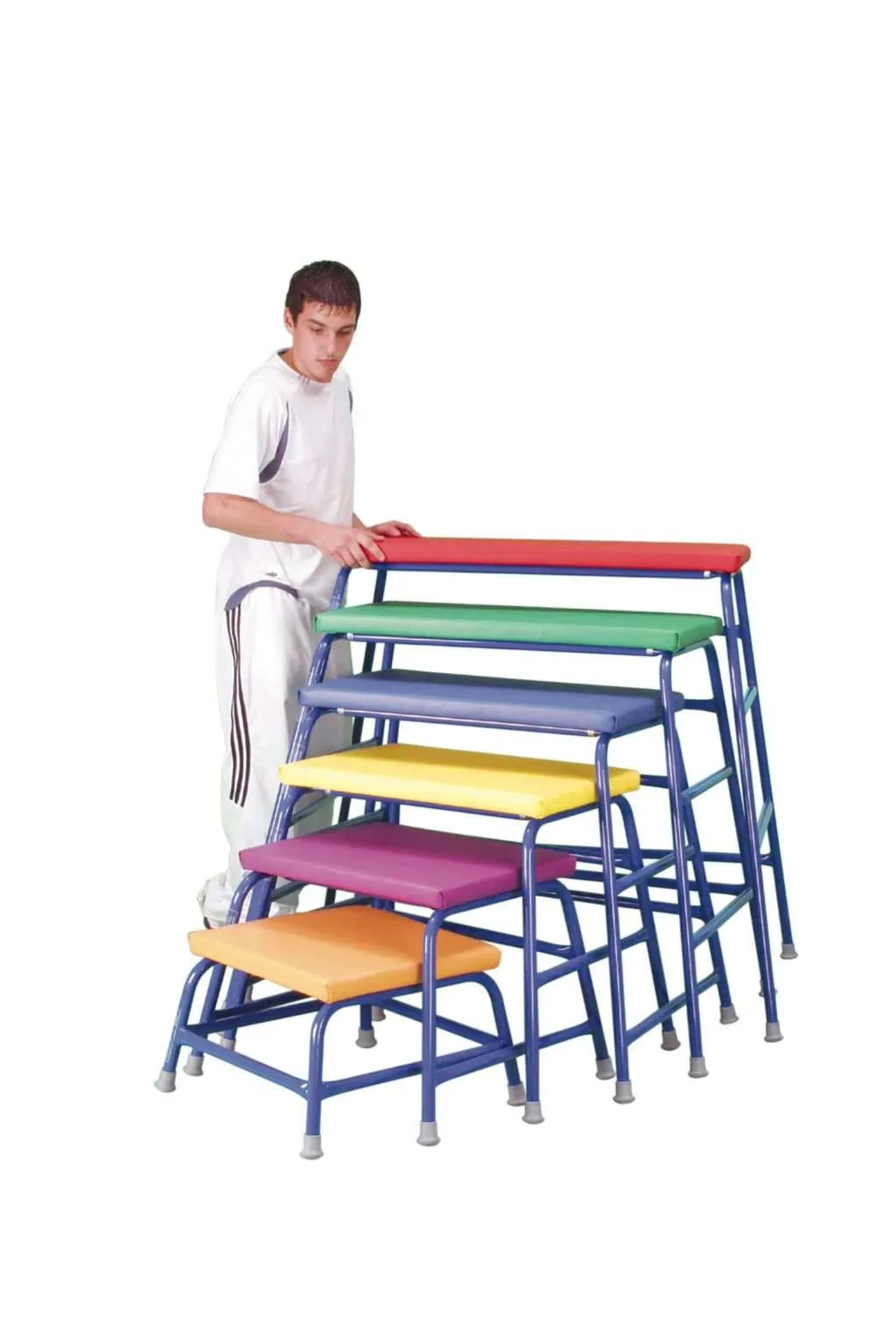 Man standing next to a stacked set of six agility tables with padded red, green, blue, yellow, purple and orange tops and blue metal frames.