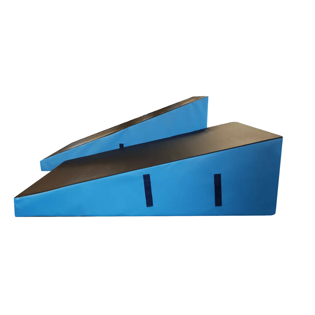 Two blue wedge blocks with black tops and heavy-duty flame-retardant PVC covers, each with stitched carry handles.