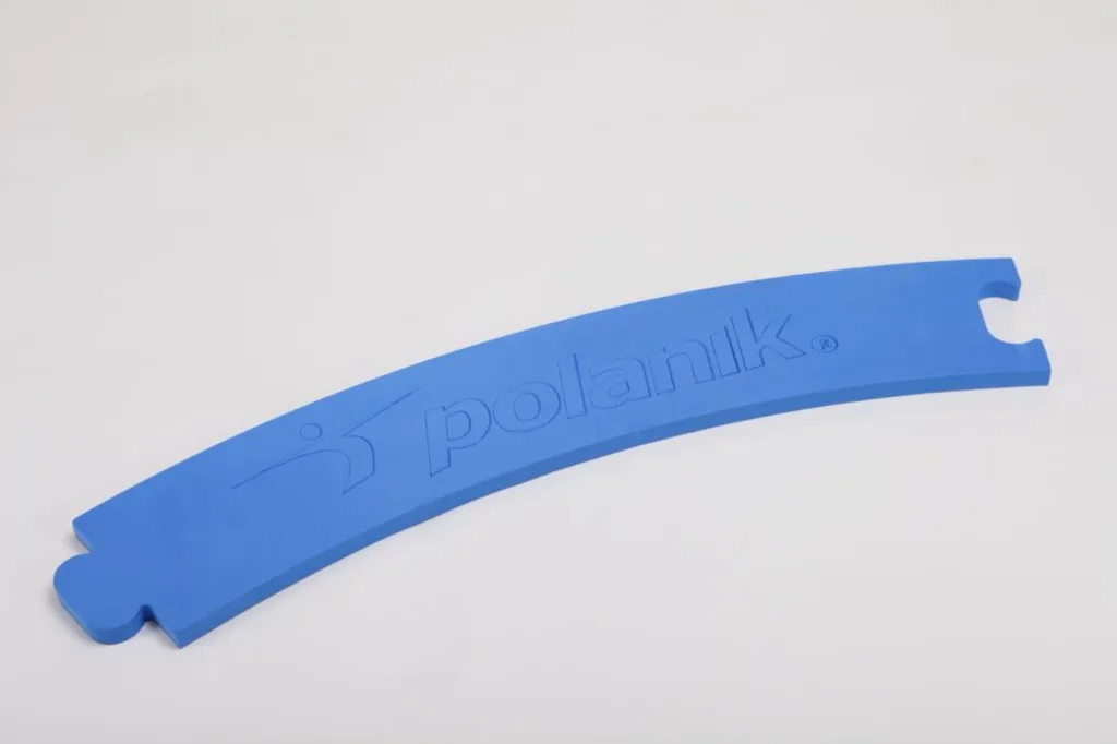 Blue foam throwing circle segment with interlocking ends and embossed lettering on a plain light background.