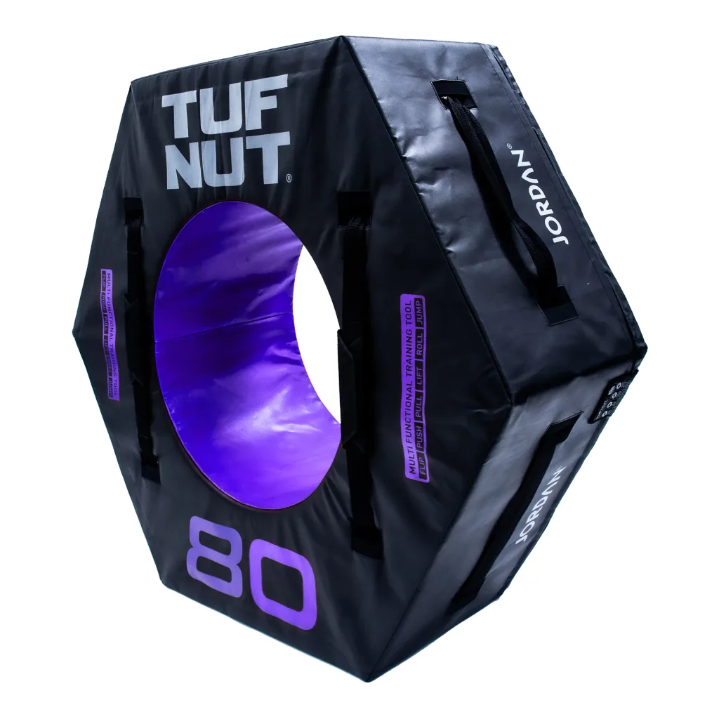 Hexagonal black padded training nut with purple circular hole, text "TUF NUT", "80" and "JORDAN" visible, and multiple carrying handles.