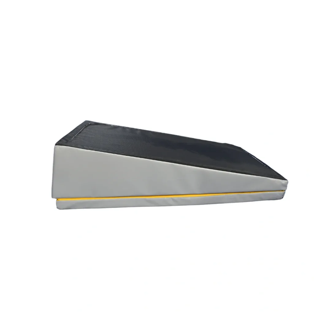 Roly poly somersault mat with black top, grey sides and yellow trim, high-density foam core with tear-resistant, phthalate-free wipe-clean cover and anti-slip base.