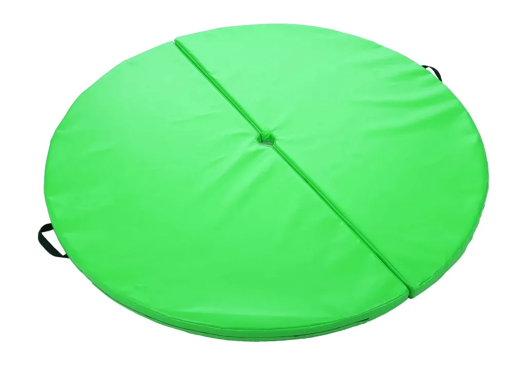 Bright green two-piece round PVC pole-dancing mat with a central hole, midline seam and black carry handles.