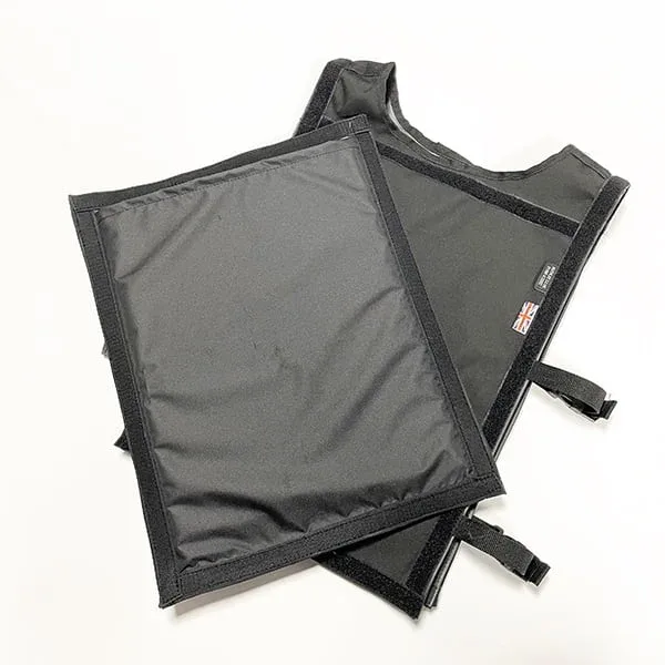 A black CED training vest and rectangular leg guard for manikins overlap on a white background.