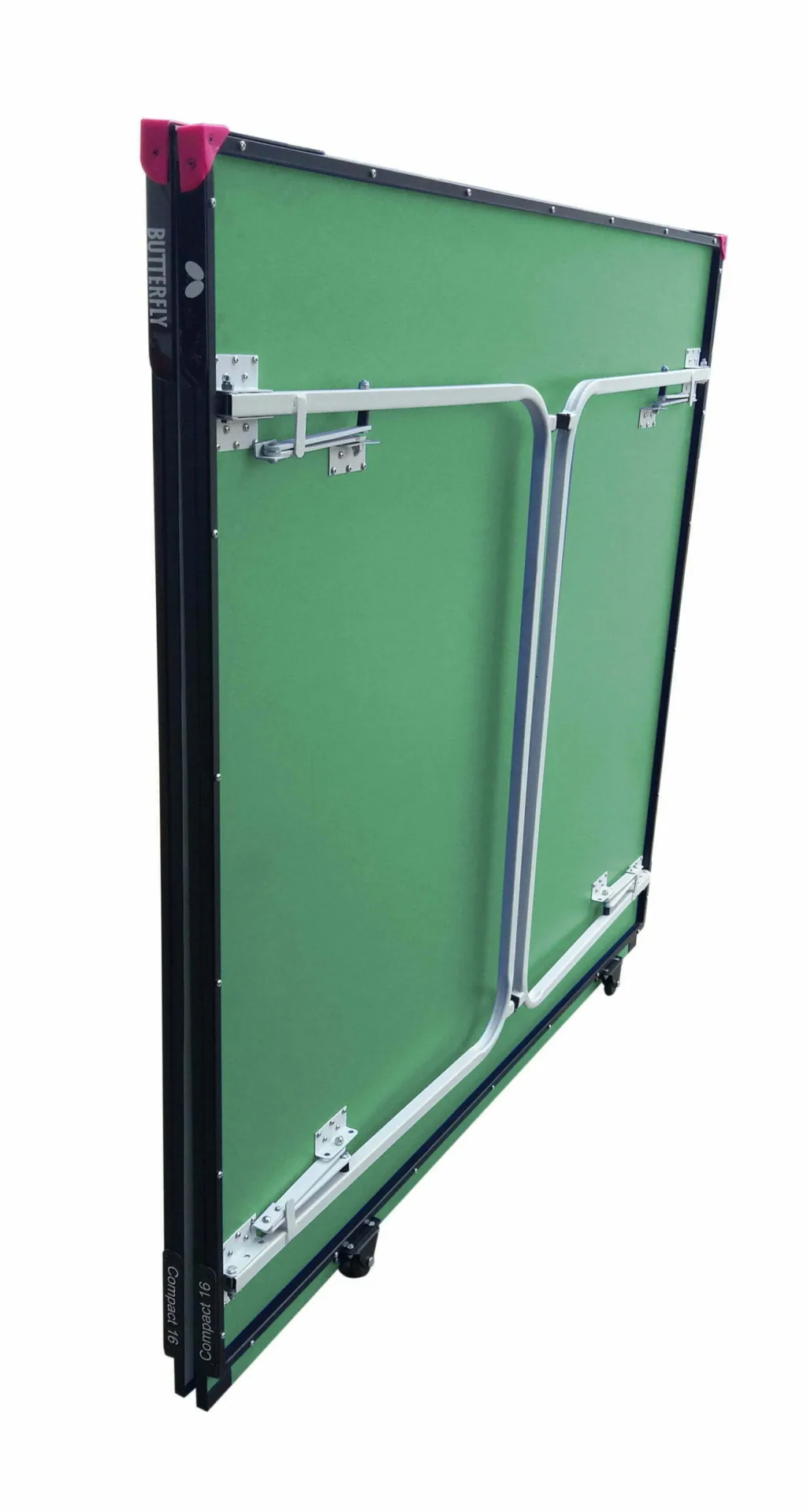 Folded Compact 16 Wheelaway table tennis table with green playing top, light silver folding legs and undercarriage, magenta corner protectors and wheels.