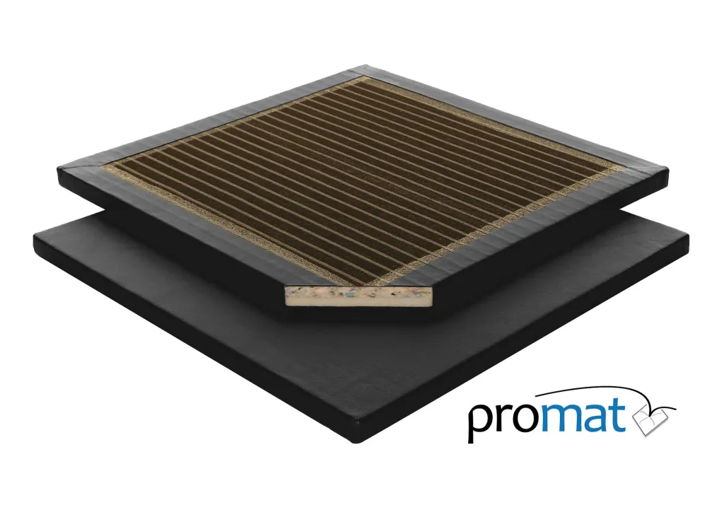 Black midweight gym mat with heavy-duty flame retardant PVC cover, cutaway revealing beige 50/50 foam core and striped brown top, promat visible.