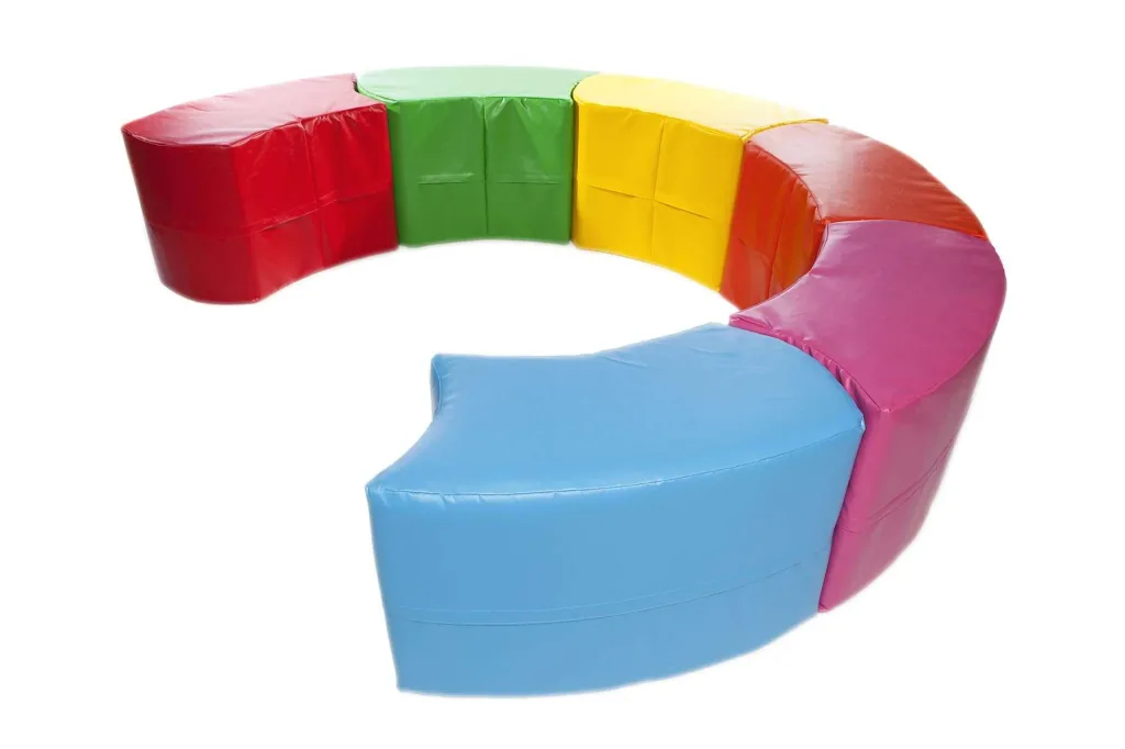 Six foam-filled modules with PVC covers and flame-resistant fillings arranged in a curved snake shape in random colours.