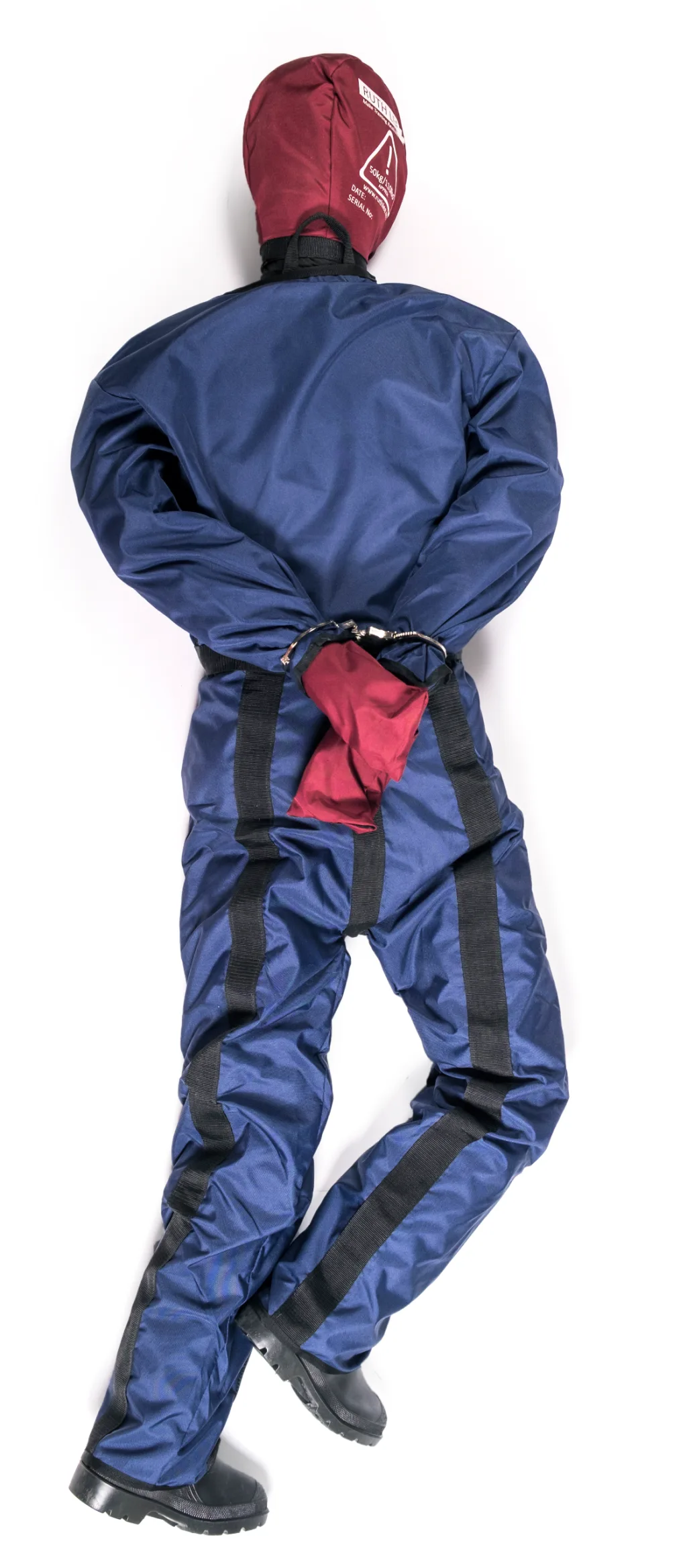 Prisoner security manikin wearing blue flame-retardant polyester overalls and a maroon hood, hands cuffed behind its back and black boots showing.