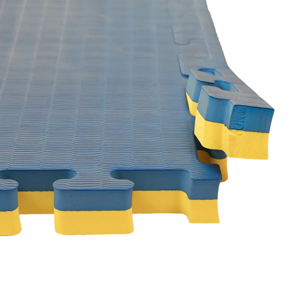 Blue and yellow interlocking EVA foam jigsaw mats with tatami-textured surface and visible puzzle-style edges.