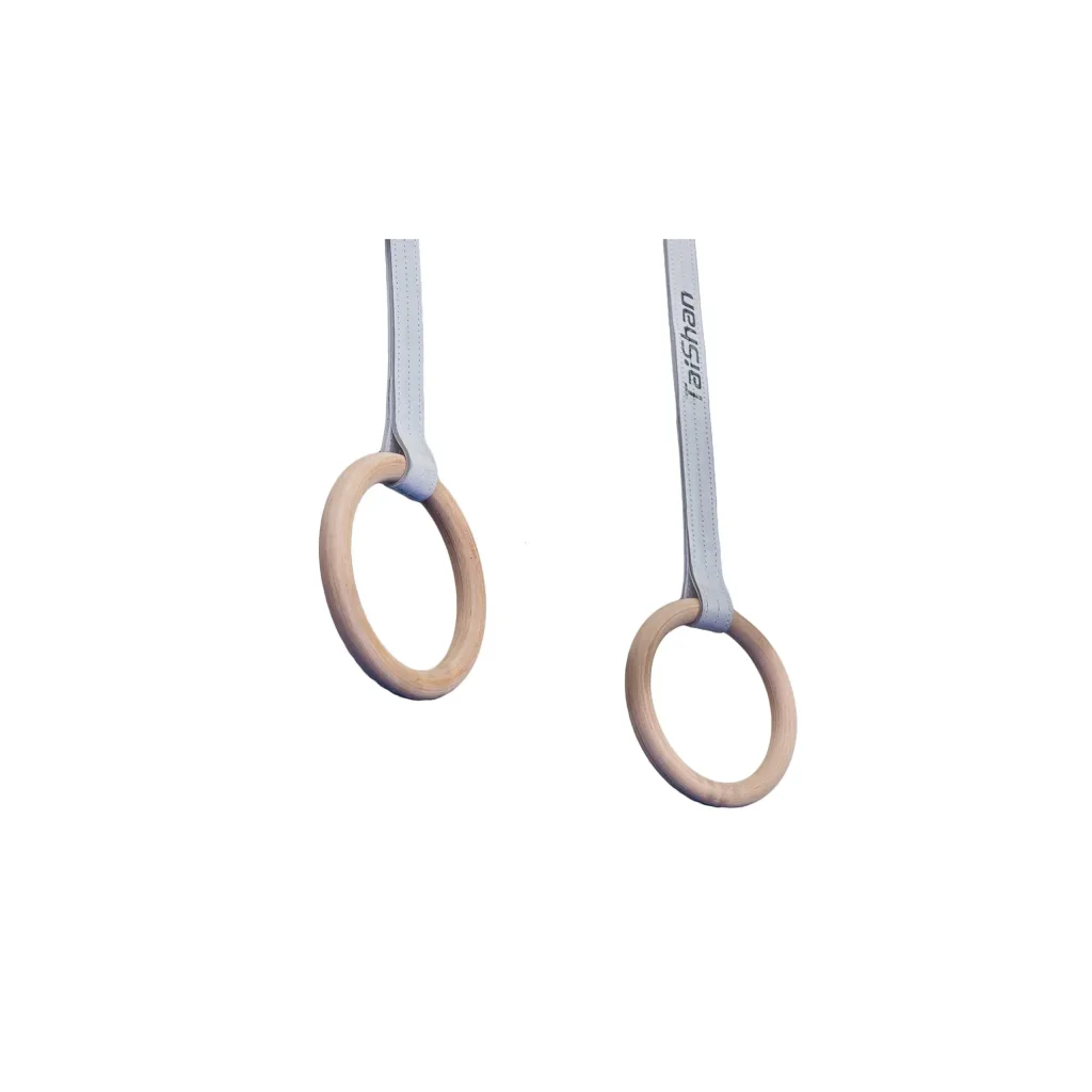 Two red composite wood gymnastics rings hanging from adjustable straps against a white background.