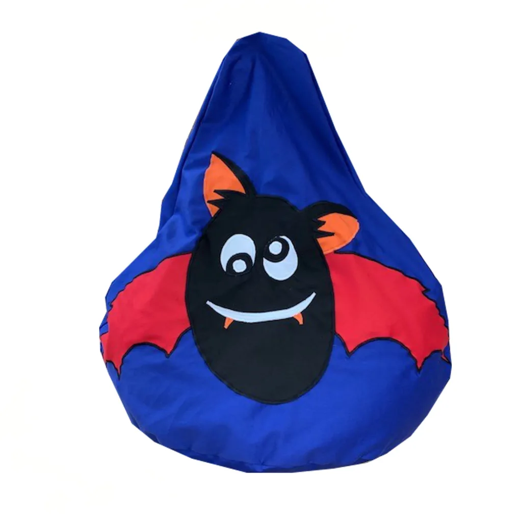 Blue bean bag with a black cartoon bat face, red wings, orange inner ears and fanged white smile.