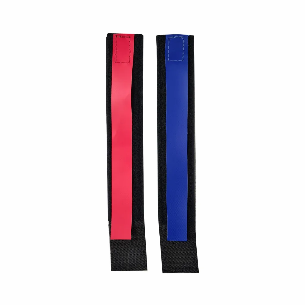 Two wrestling ankle bands with a red identification strip and a blue identification strip on black hook-and-loop straps.