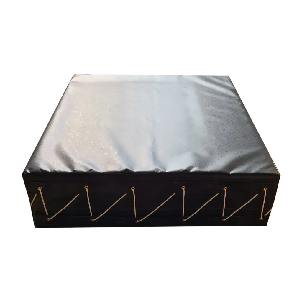 Black keg mat with heavy-duty fire-retardant PVC cover, dual-density foam core and metal eyelets with lacing along the sides.
