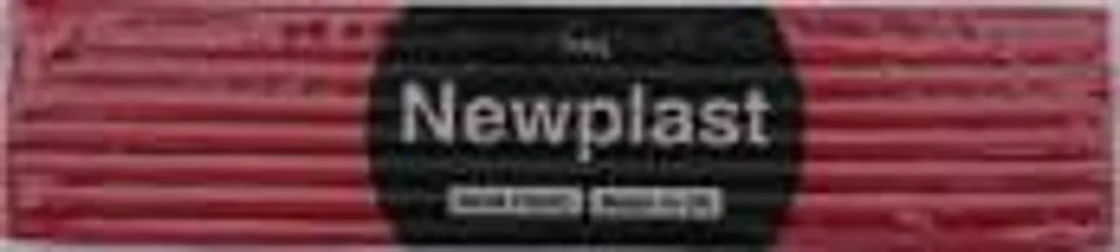 Red plasticine bar wrapped in a black label reading Newplast.