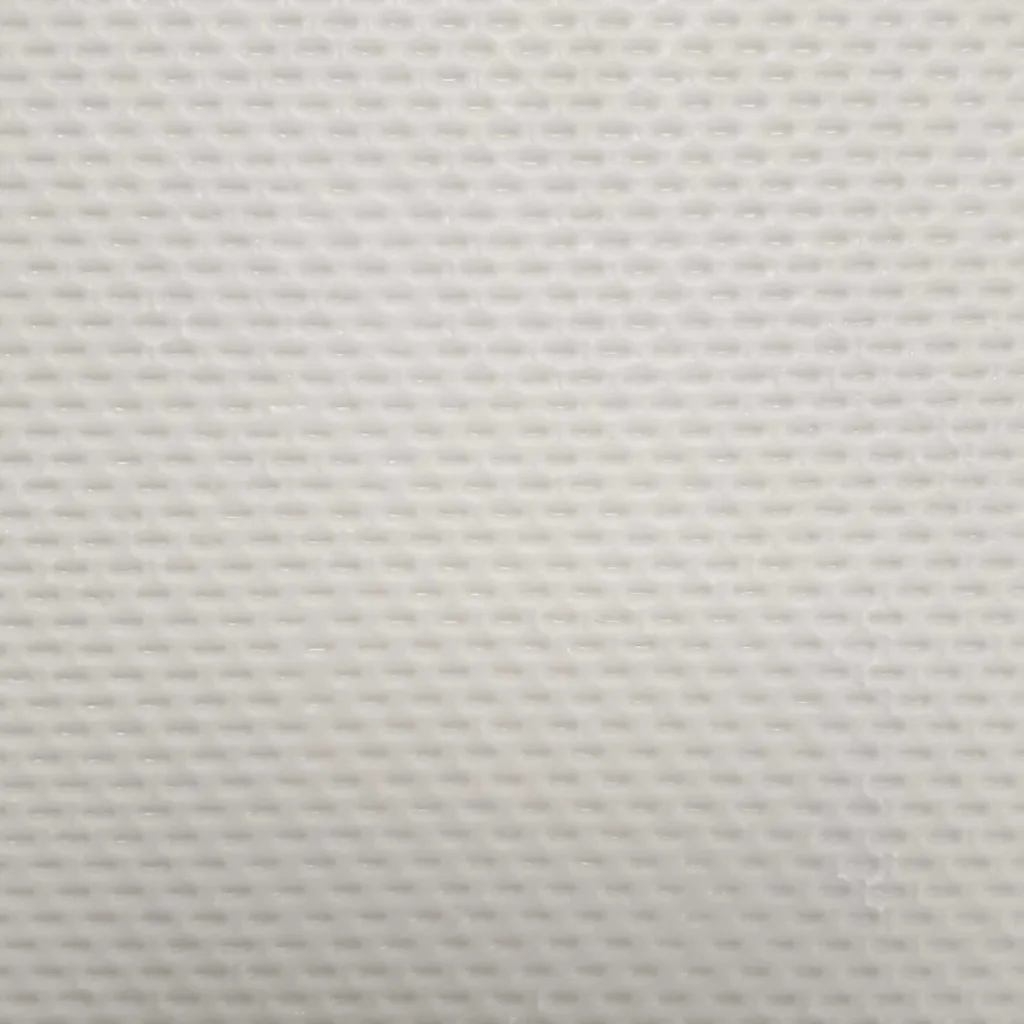 Grey sports hall carpet tile close-up showing a small repeating waffle-like textured pattern across the surface.