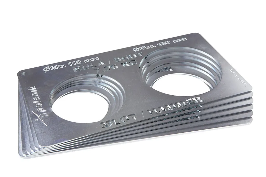 Stack of metal rectangular certification gauges with two stepped circular cutouts labeled "ØMin 110 mm" and "ØMax 130 mm".