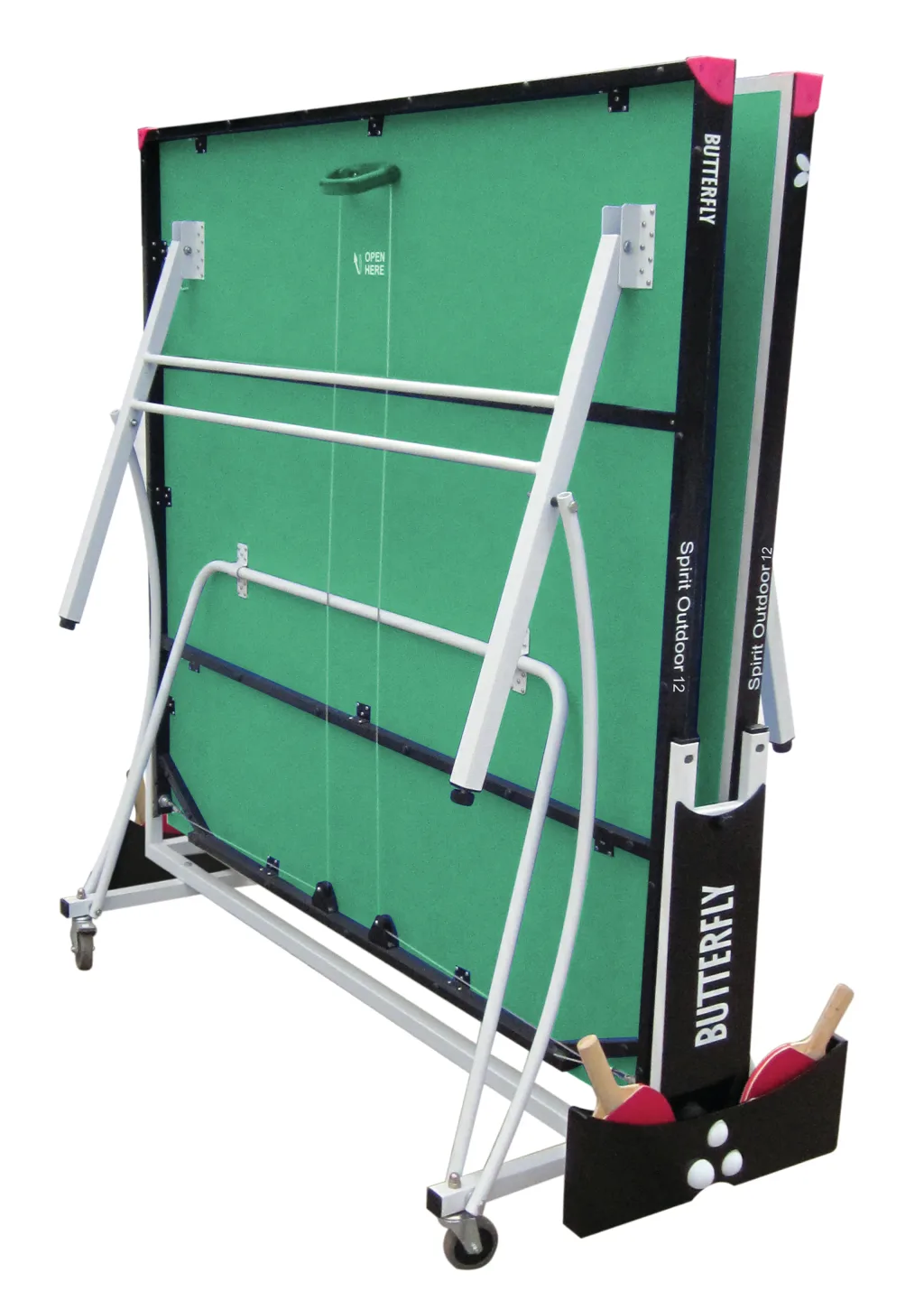 Folded rollaway table tennis with green top, silver legs, magenta corner protectors, caster wheels, bat holder with two red bats and 'OPEN HERE'.