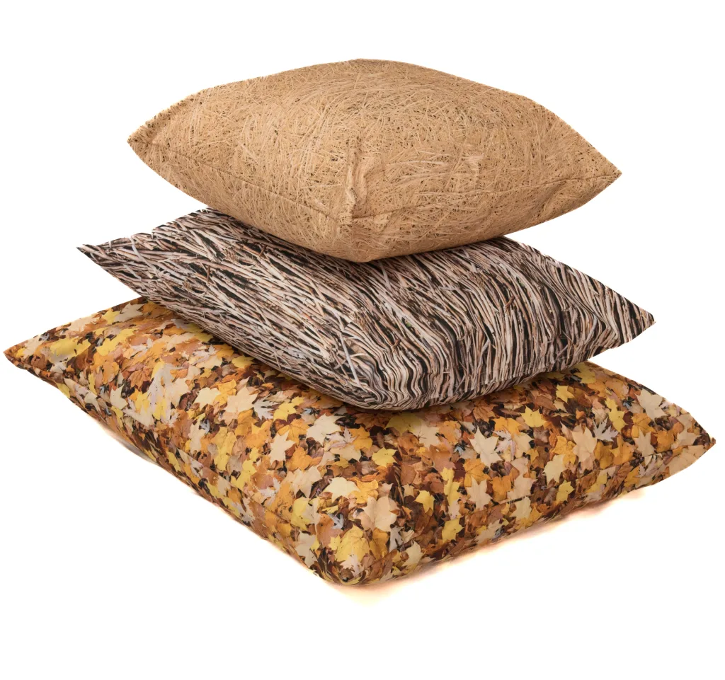 Stack of three large nature-print floor cushions with 100% polyester covers, leaf, wood and straw-like patterns.