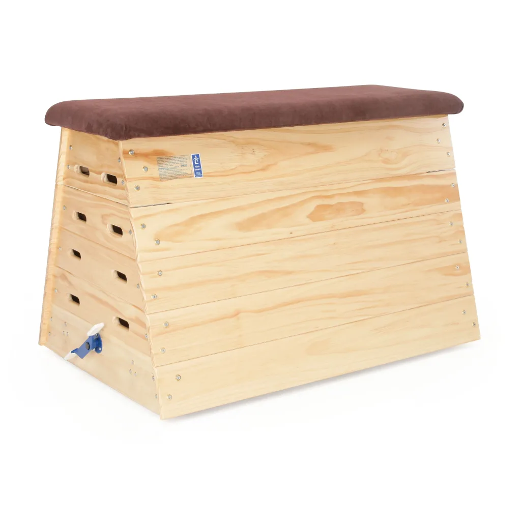 Five-section timber vaulting box with a brown hide padded top, interlocking sections and cutout side handles.