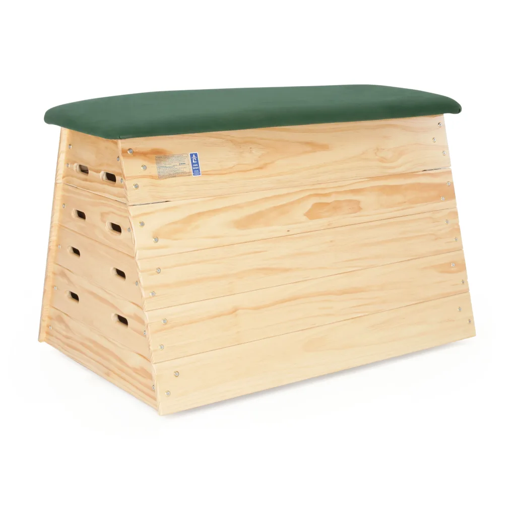Five-section wooden vaulting box with interlocking stacked panels and a green padded hide top.