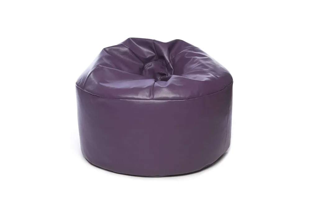 Purple faux leather bean bag for teens and adults, cylindrical with a slouched, creased top and smooth sides.