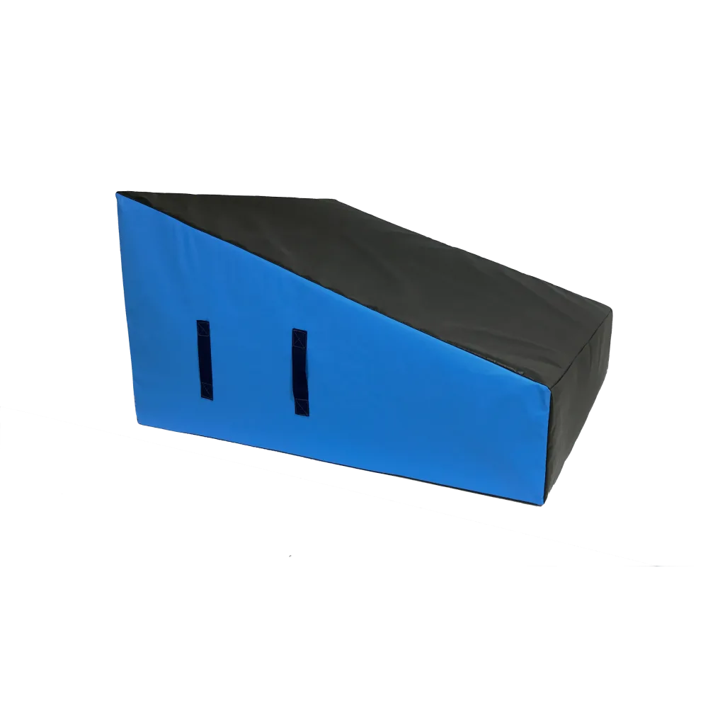 Wedge block ramp with sloped top and two carry handles, covered in heavy-duty flame-retardant PVC.