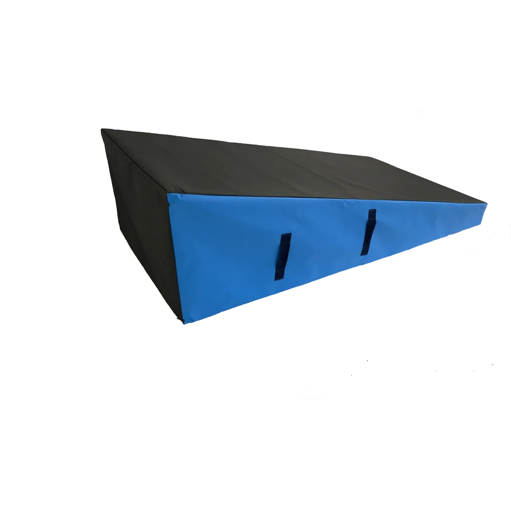 Blue-front wedge block with black heavy-duty flame-retardant PVC cover and two carry handles, angled foam ramp for gymnastics.