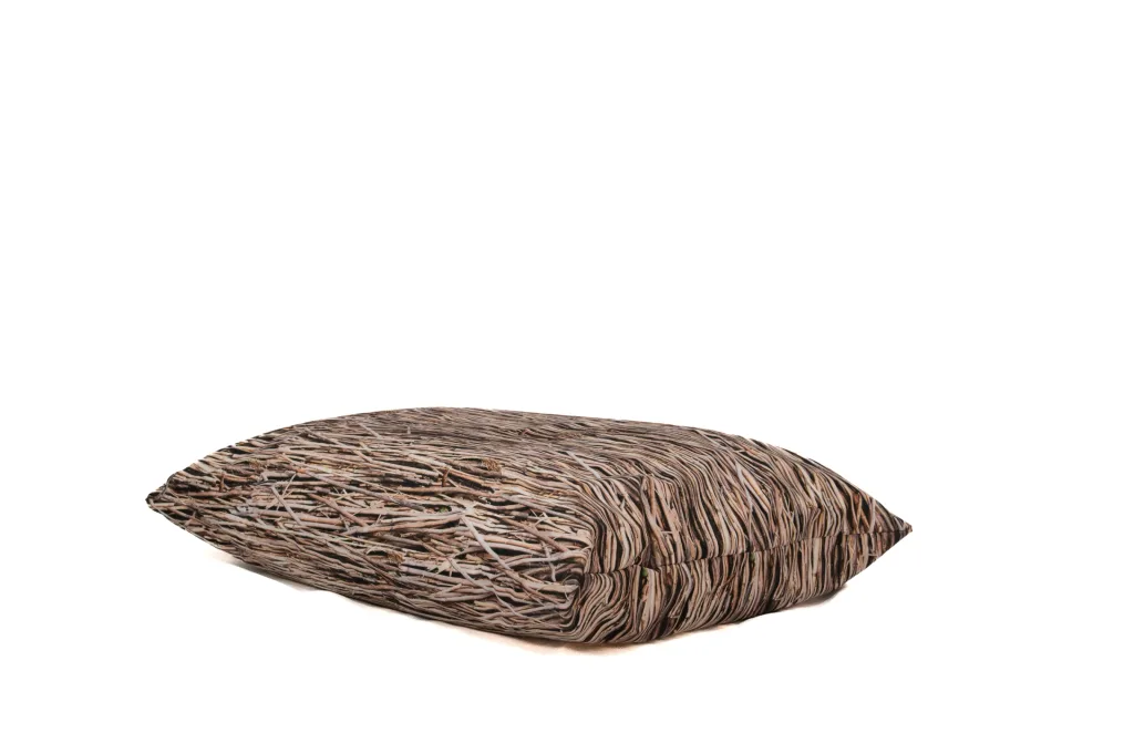 Large nature-print floor cushion with brown twig-pattern polyester cover resting on a white background.