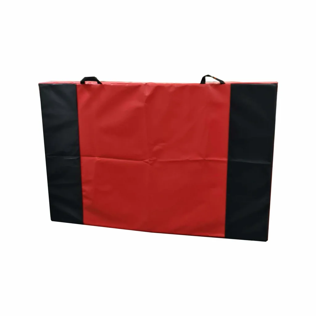 Red jersey crash mat with black side panels, two black top handles, breather holes and a zipped nylon-reinforced PVC cover.