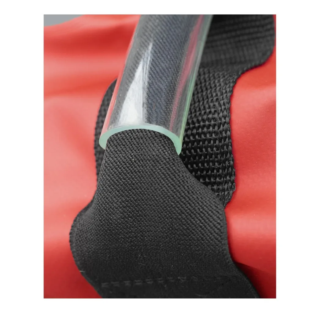 Red heavy-duty vinyl pole vault bag end with leather-reinforced black woven strap holding a clear tube.