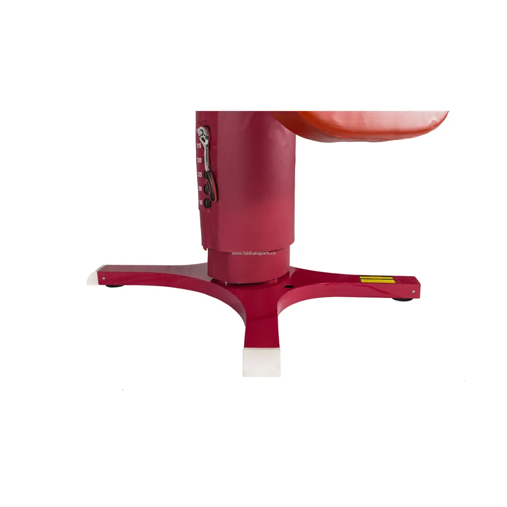 Red competition vaulting table base with central column, three-legged support, white foot caps, and height markings 115 120 125 130 135.