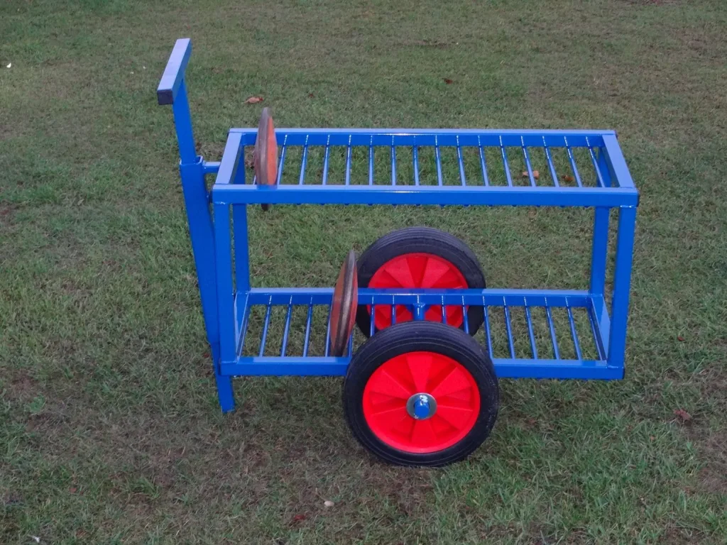 Blue powder-coated steel discus trolley with two slatted shelves, a two-position vertical handle, and two red wheels with black tires.