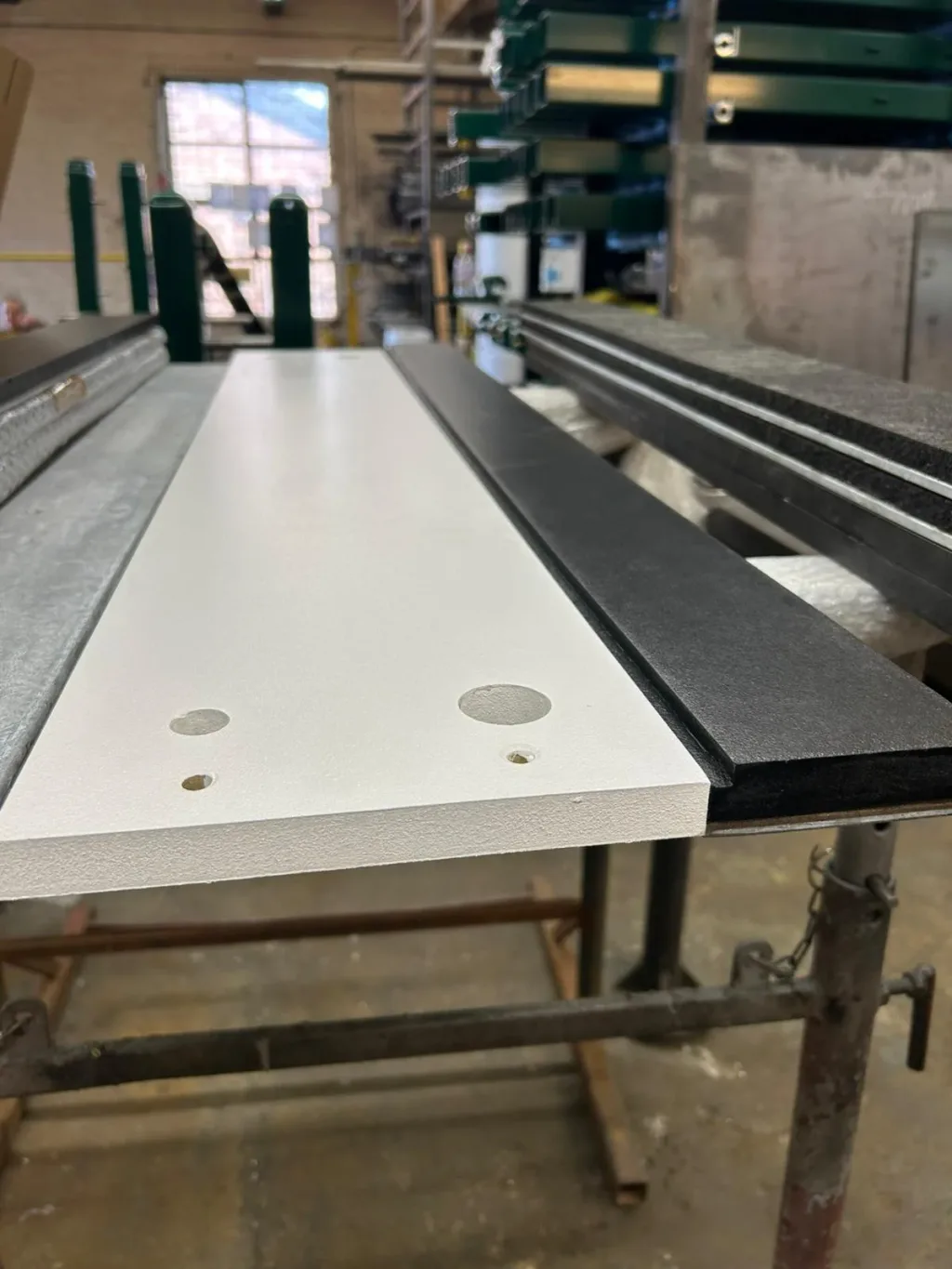 Cantabrian take off board with durable wood top with pre-drilled holes on reinforced galvanised steel frame and black rubber edge.