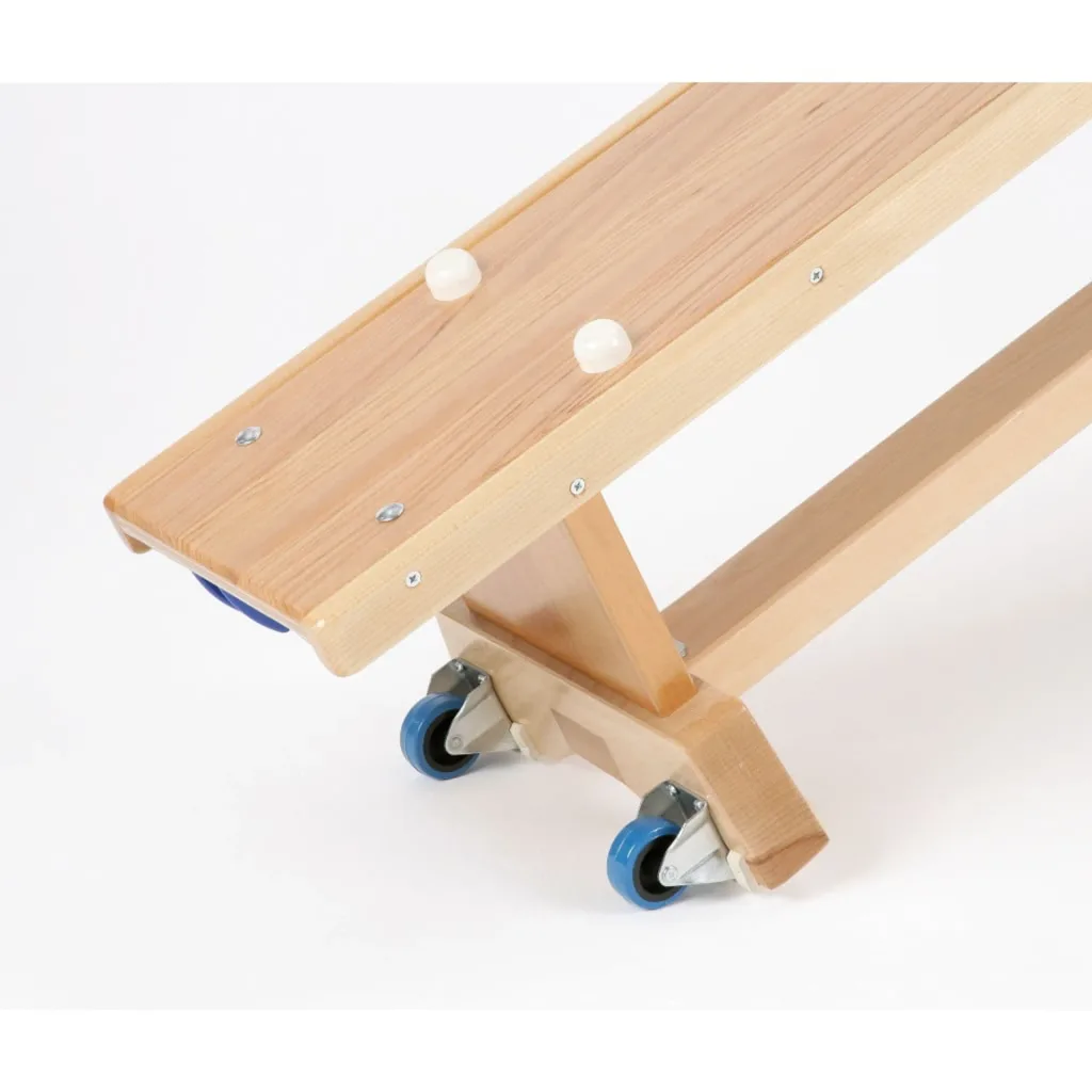 Hardwood balance bench end with rubber buttons on top and castors mounted on the foot.