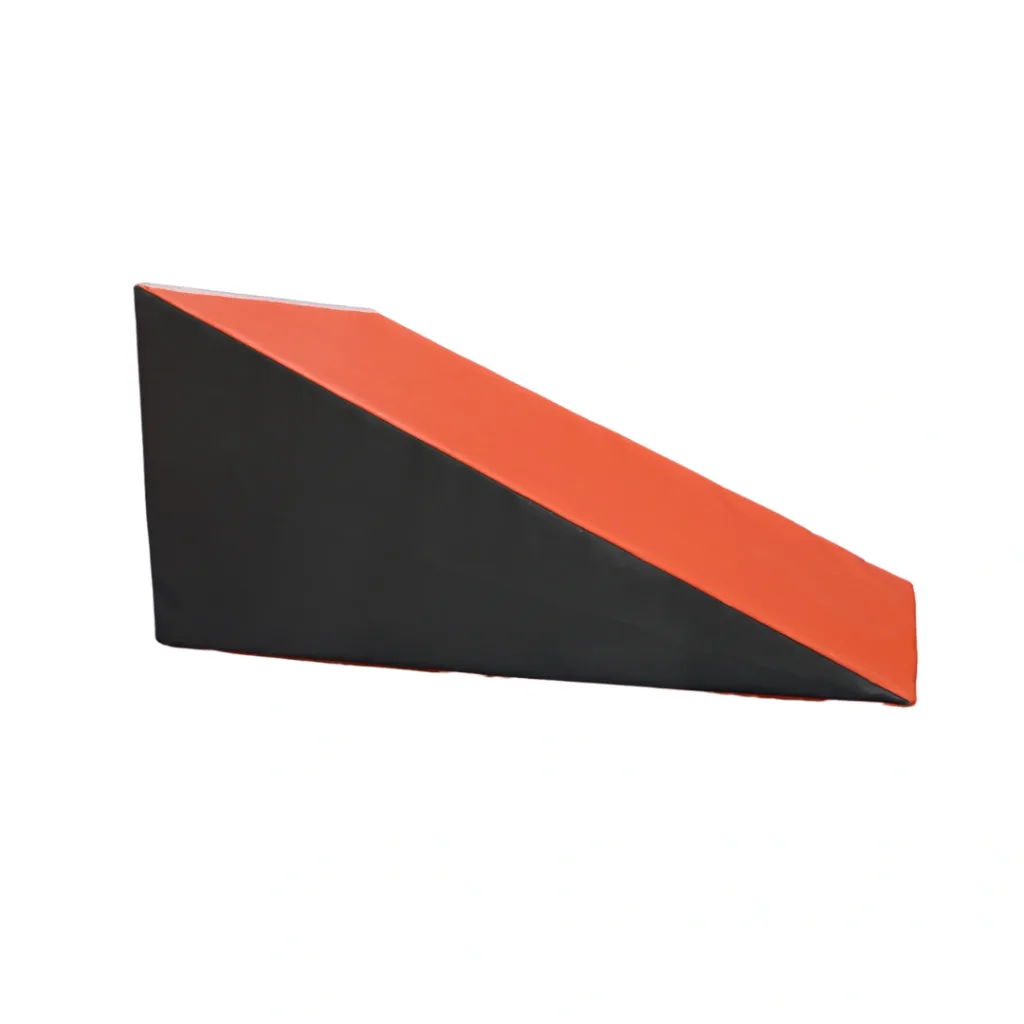 Large foam gymnastics wedge with orange top and grey sides.