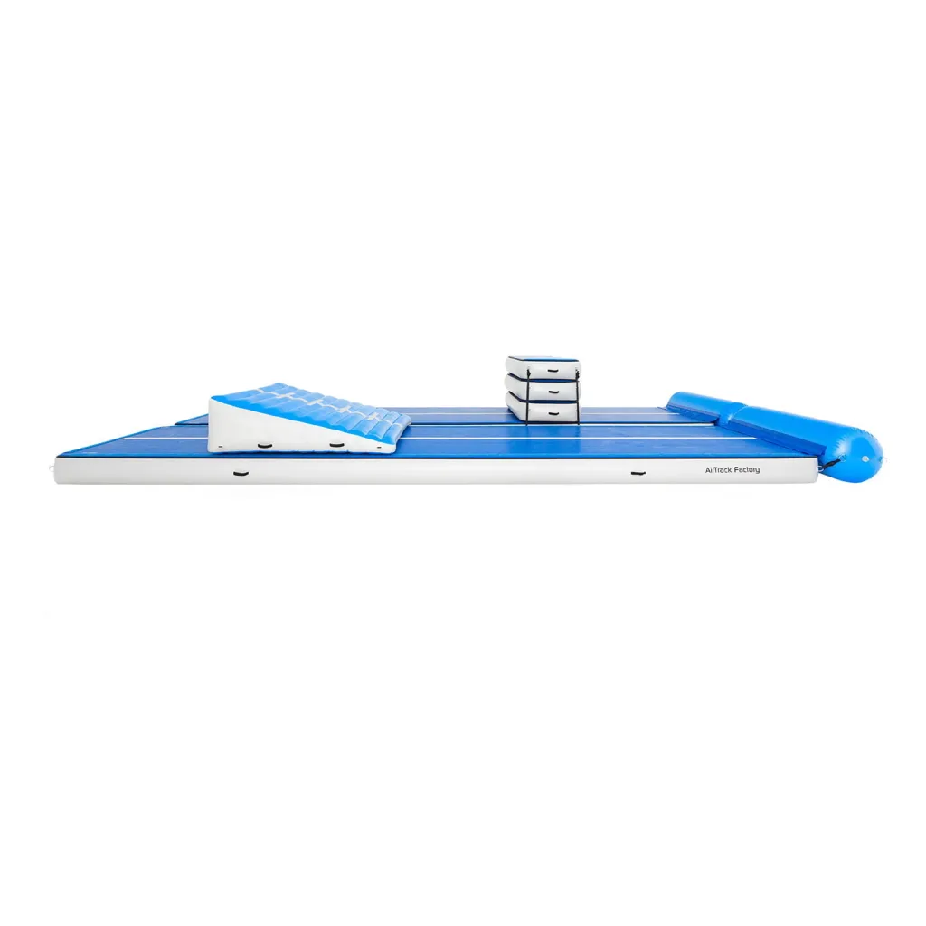 Blue and white inflatable AirTrack TakeOff set with incline ramp, stacked mats, and text AirTrack Factory on the side.
