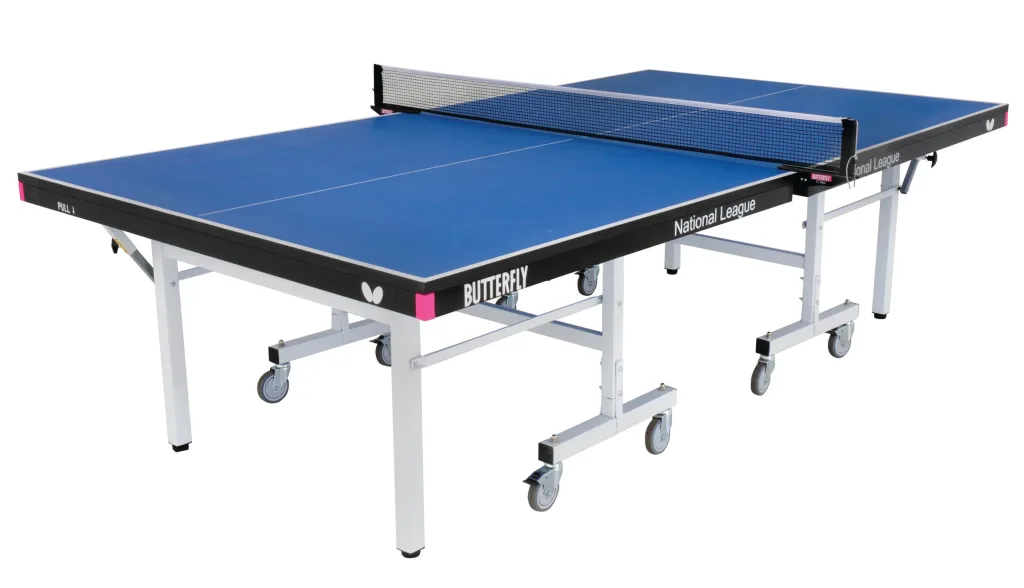 Table tennis table with blue playing top, light silver legs and undercarriage, magenta corner pieces, wheels, net and visible text 'BUTTERFLY' 'National League'.