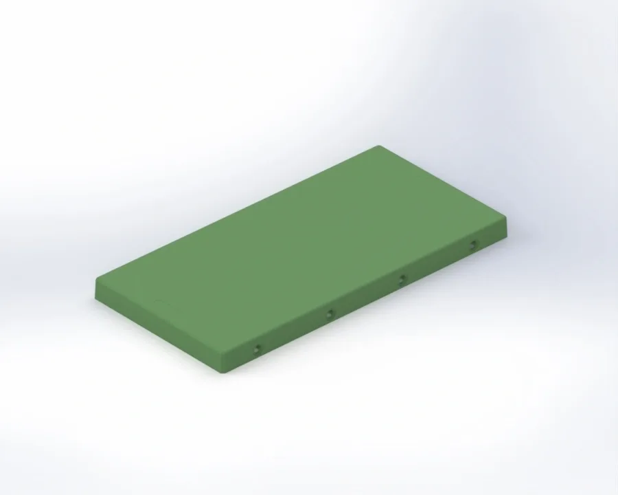 Green rectangular training block with beveled edges and four molded connector holes along one long side.