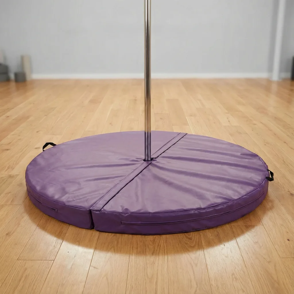 Round purple heavy-duty PVC two-piece pole dancing mat with a center hole and carry handles surrounding a chrome pole.