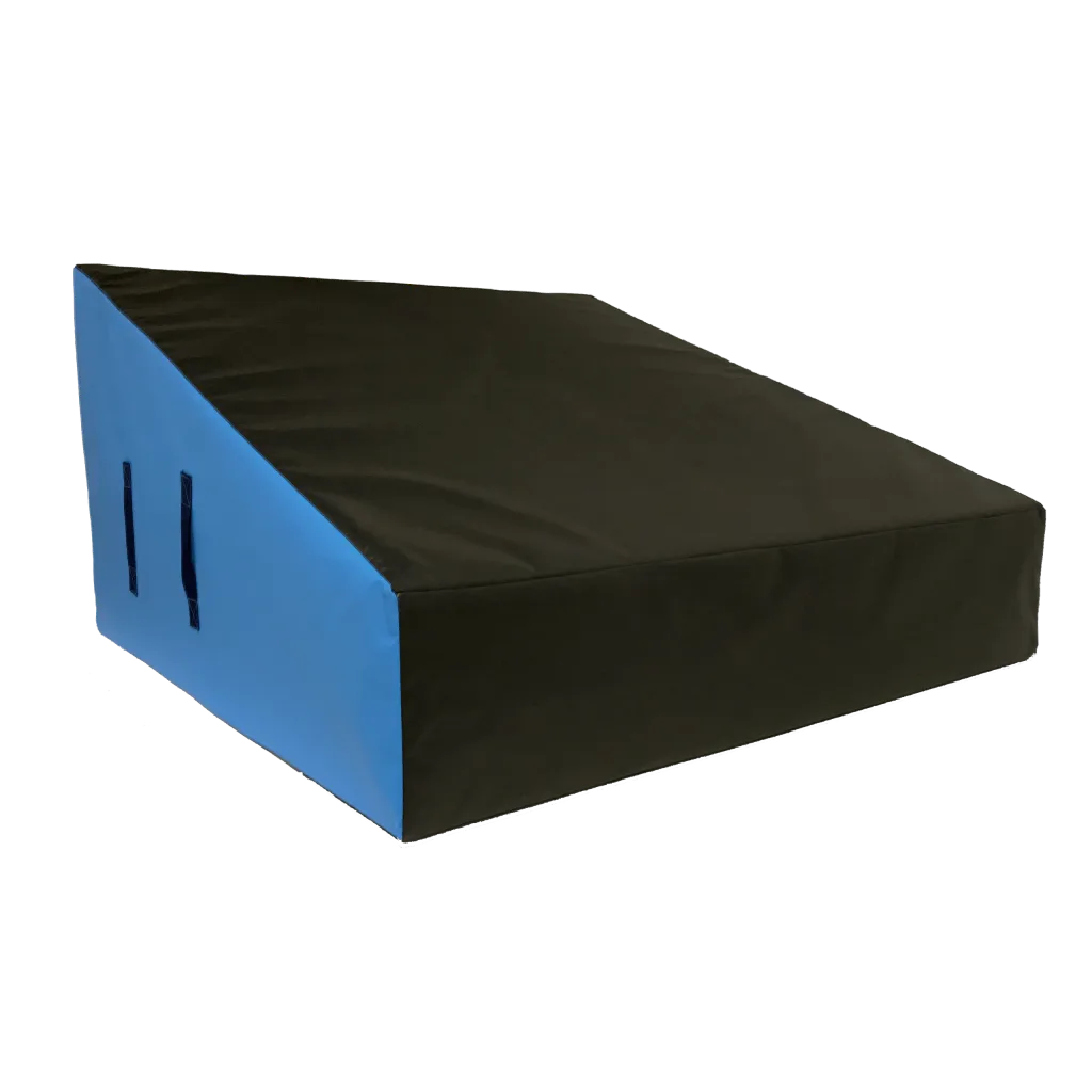 Blue-sided wedge ramp with a black top, a heavy-duty flame-retardant PVC cover, and side carry handles for gymnastics and parkour.