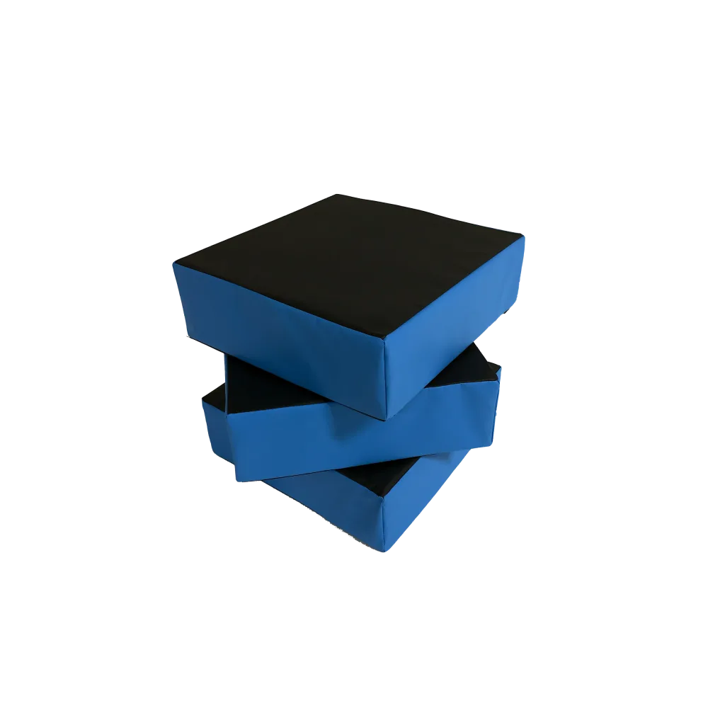 Three PVC-covered foam stepping blocks with blue sides and black tops stacked staggered on a black background.