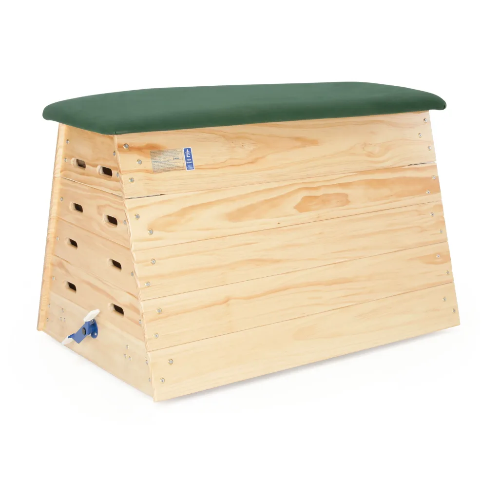 Five-section wooden vaulting box with stacked interlocking panels and a green padded hide top.